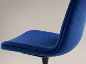 Close-up of blue armless chair.