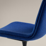 Close-up of blue upholstered chair