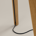 Close-up of wood table leg with cable management