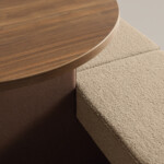 Close-up of upholstered bench and integrated wood table
