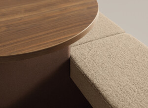 Close-up of upholstered bench and integrated wood table