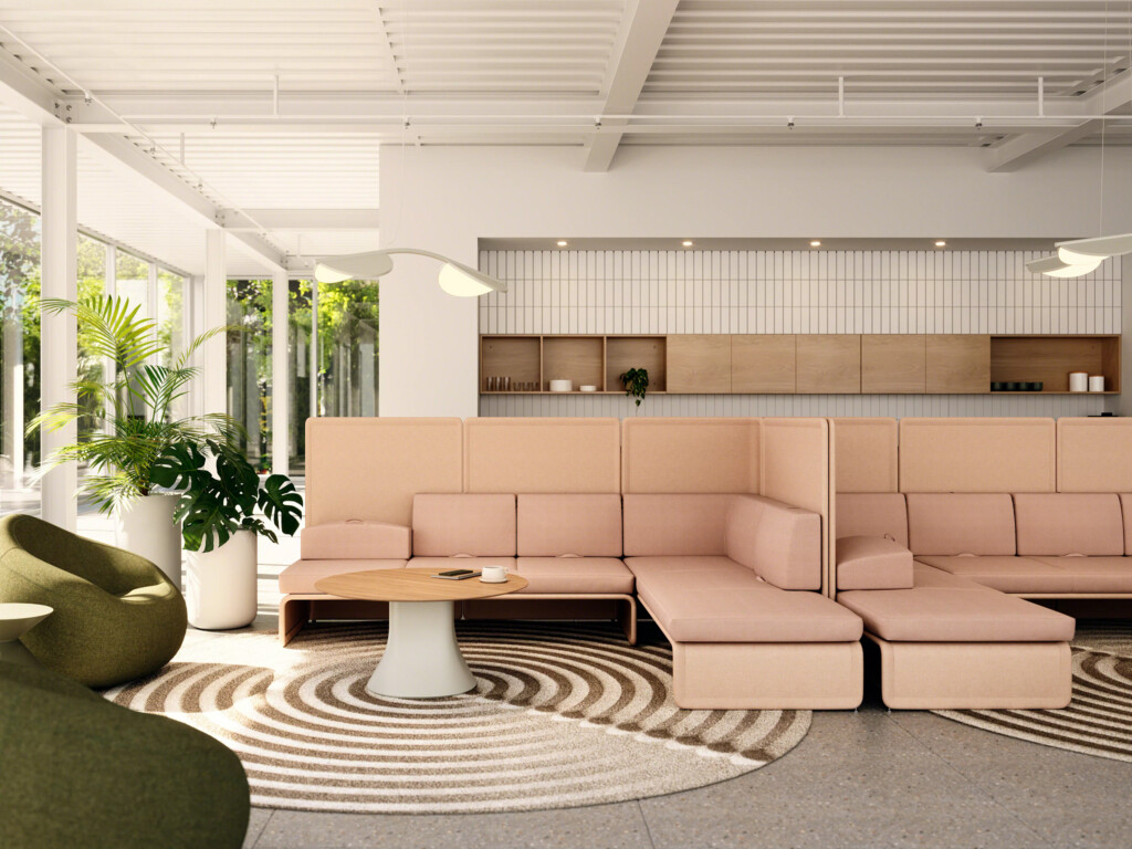 Modern lounge area with modular upholstered seating, round wood tables, and accent chairs