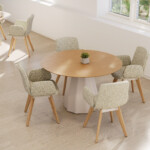 Modern round dining table with upholstered chairs and wood legs