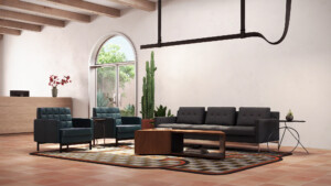 Modern lounge area with sofa, armchairs, wood coffee table, patterned rug, and reception desk