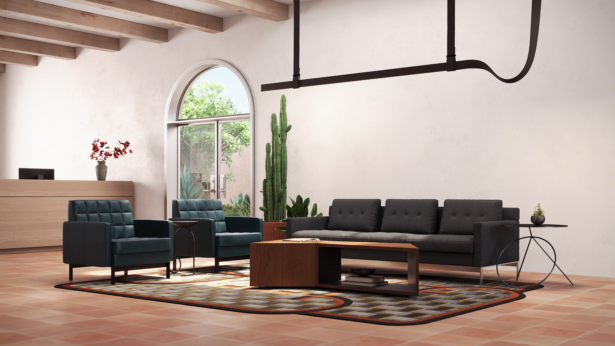 Modern lounge area with sofa, armchairs, wood coffee table, patterned rug, and reception desk