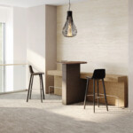 Two chairs with upholstered bench and integrated wood table in the middle