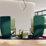 Modern collaborative lounge setup with two green high-back sofas, integrated tables, and ottomans