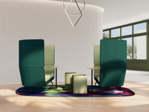 Modern collaborative lounge setup with two green high-back sofas, integrated tables, and ottomans