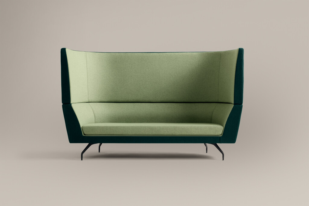 green high-back lounge sofa against neutral background