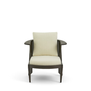 Modern upholstered lounge chair with wood frame on neutral background