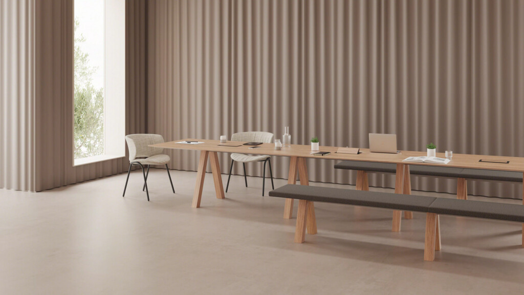 Minimalist dining setup with a long wooden table, bench, and matching chairs near a bright window.