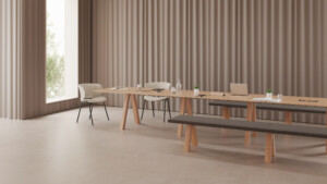 Minimalist dining setup with a long wooden table, bench, and matching chairs near a bright window.