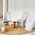 Four chairs arranged around a coffee table