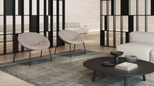 Interior room with two lounge chairs and a sofa around a mini black table