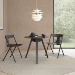 Quadra chairs around a round table.