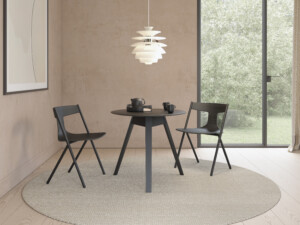 Quadra chairs around a round table.