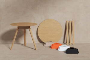 Table and wooden materials displayed on a beige environment