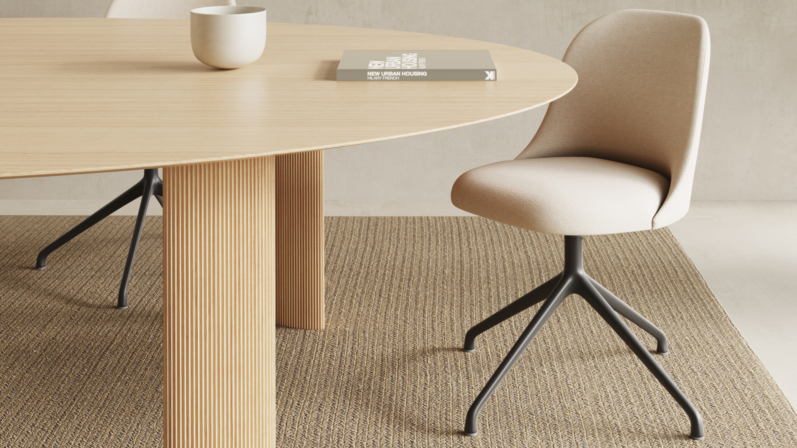 Beige armless chair beside a wood table holding a cup and a book