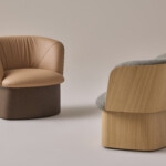 Set of two manto lounge chairs against a beige background