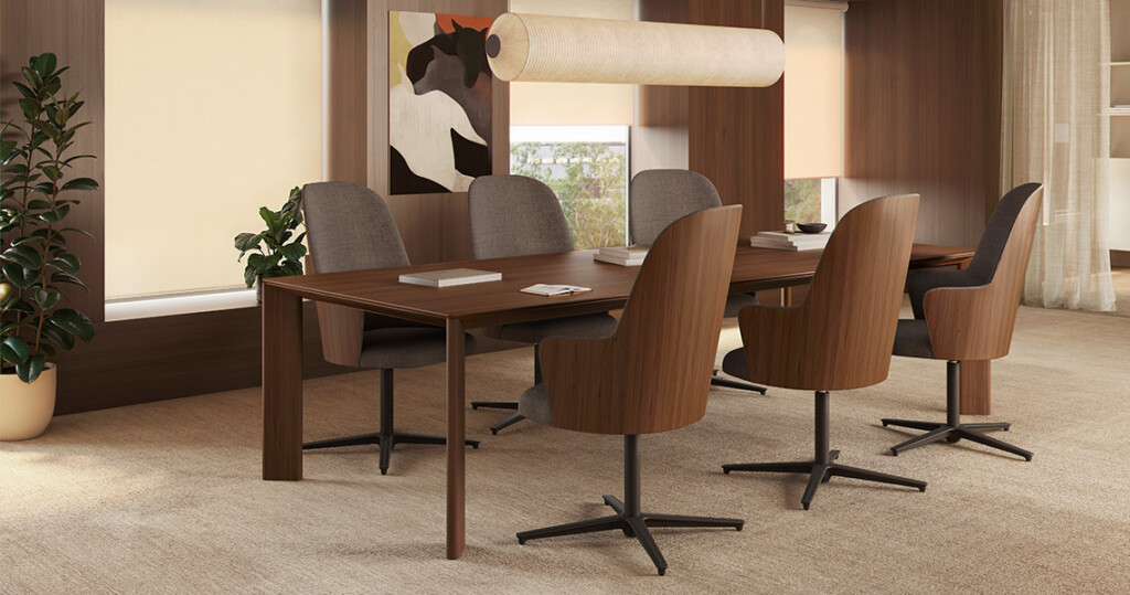 Modern lounge with a wooden conference table.