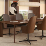 Modern lounge with a wooden conference table.