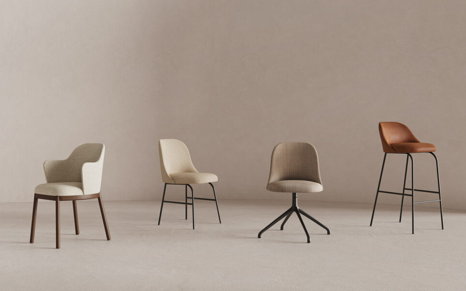Collection of chairs against neutral background