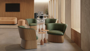 Upholstered manto chairs arranged around coffee tables.